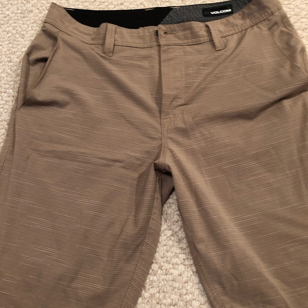 Men’s size 32 dark tan board shorts by Volcom.